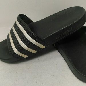 Adidas slip ons.